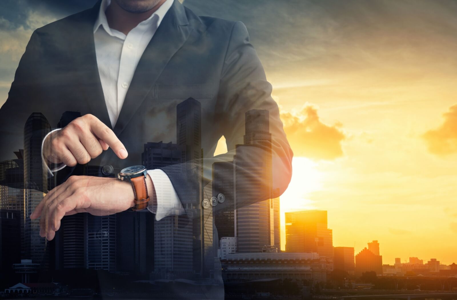 A person in a suit checks their watch, wondering whether when they'll have time to fit in a root canal.