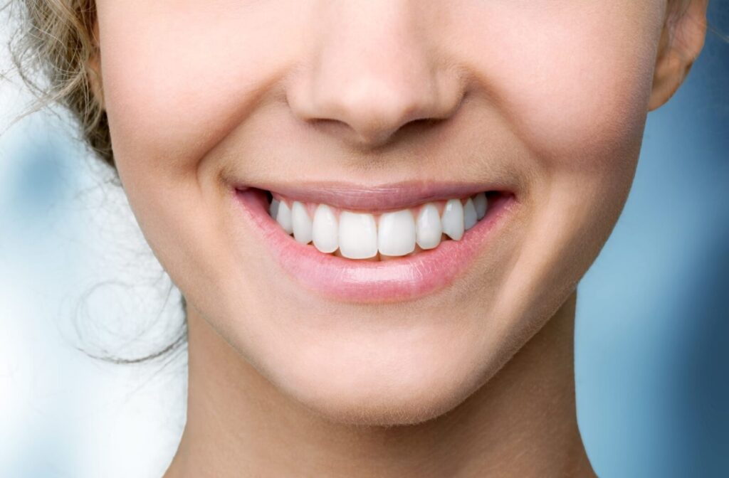 A smiling person after their root canal treatment has healed well.